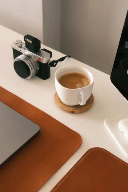 creative-01 A laptop resting on a bed with web design software open, forming a comfortable workspace.